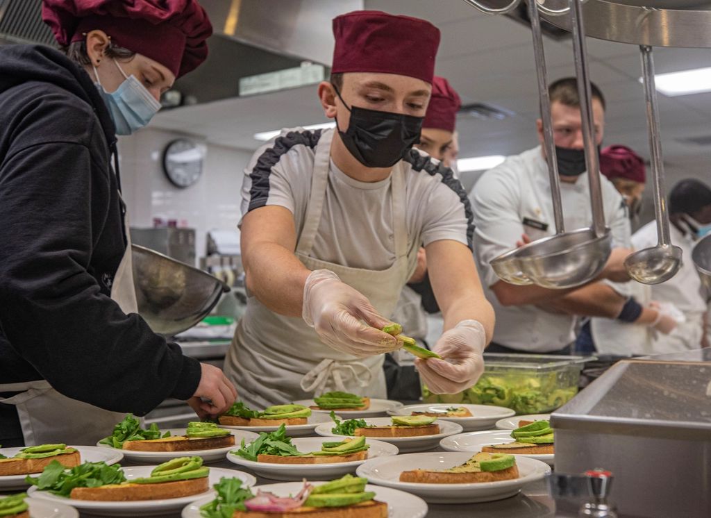 A cook working at the open kitchen
