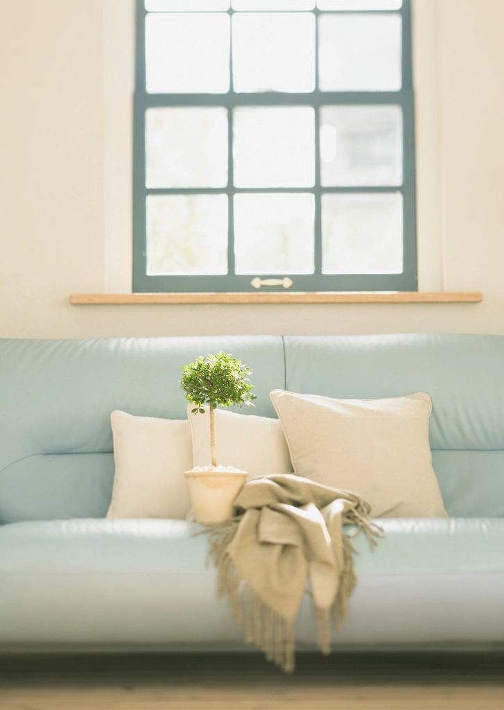 A suite sitting room with a sofa and armchairs